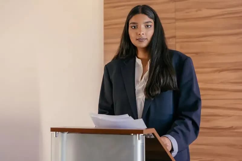 Student giving a speech at a podium